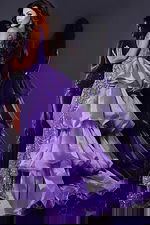 Side-back view of Jovani 38336 gown displaying deep V-back design