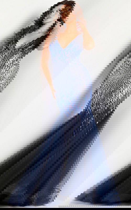 Model wearing Jovani 38373 navy mermaid gown with sequin bodice and tulle skirt, front view.