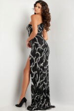 Back view of Jovani 38377 black gown with sequin patterns and high slit