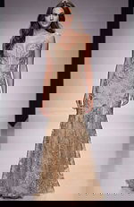 Fitted gown with sheer illusion bodice, intricate beaded embroidery, and a soft floor length silhouette that creates an elegant, refined look