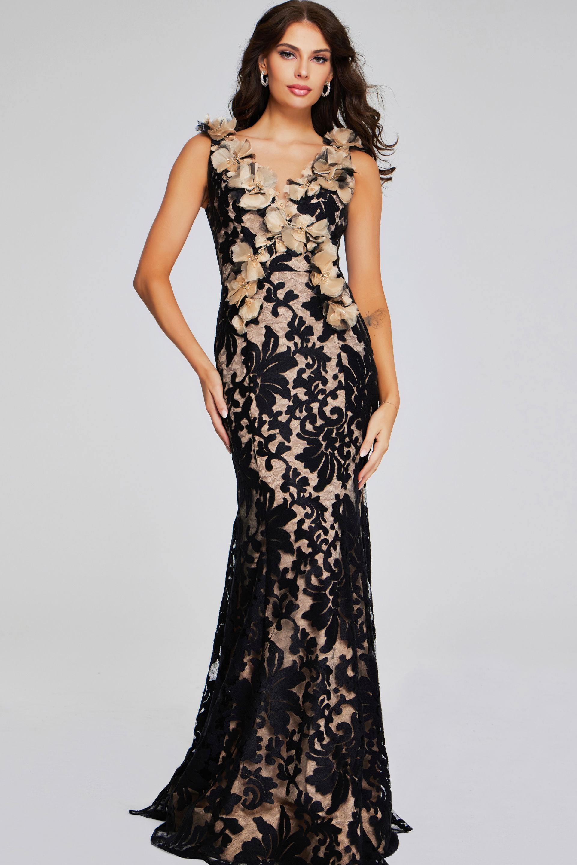 38497-BLACKNUDE-201.jpg Model wearing Jovani 38497 black lace gown with floral appliqués, front view.