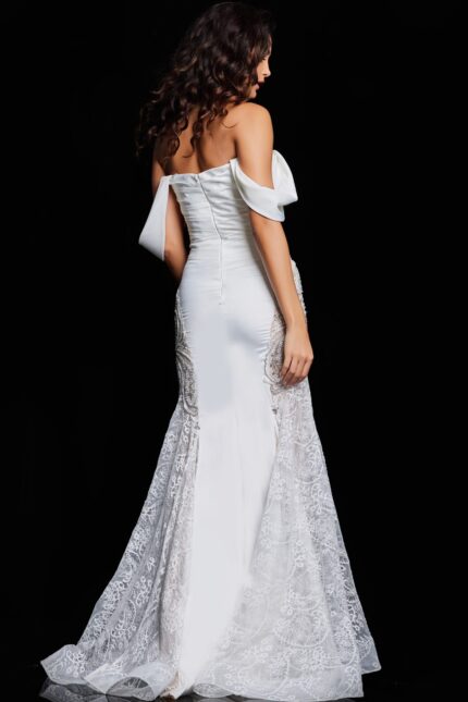 Model showing the back of Jovani 38501 ivory dress with lace skirt detailing.