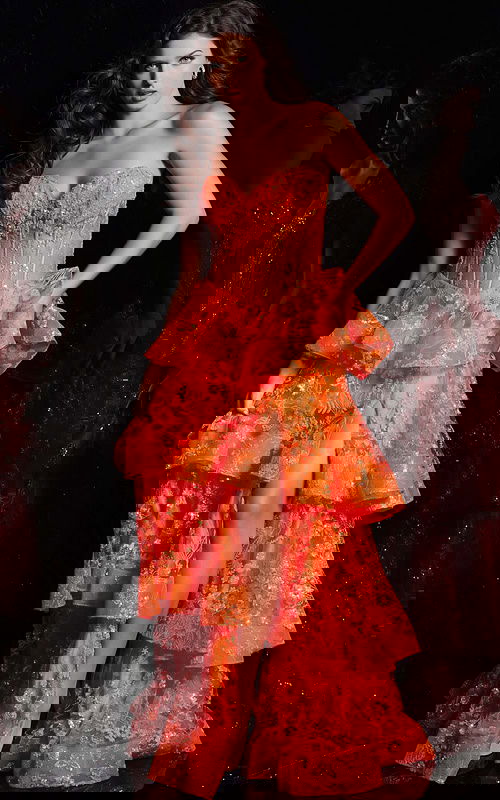 Model wearing Jovani 38528 orange dress with sweetheart neckline and high slit