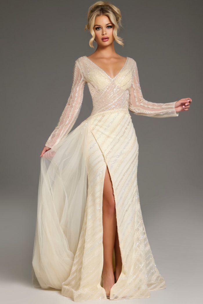 Model showcasing Jovani 38581 gold dress with elegant long sleeves and V-neck.