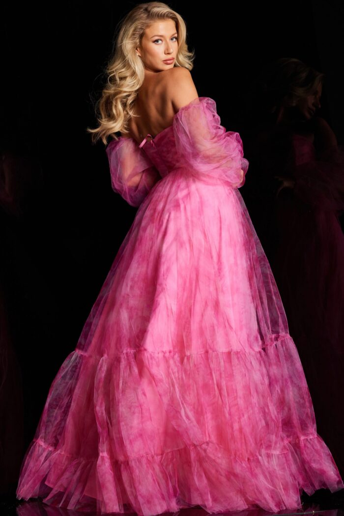 Back view of model in Jovani 38605, a fuchsia gown featuring an off-the-shoulder neckline and flowing A-line shape.