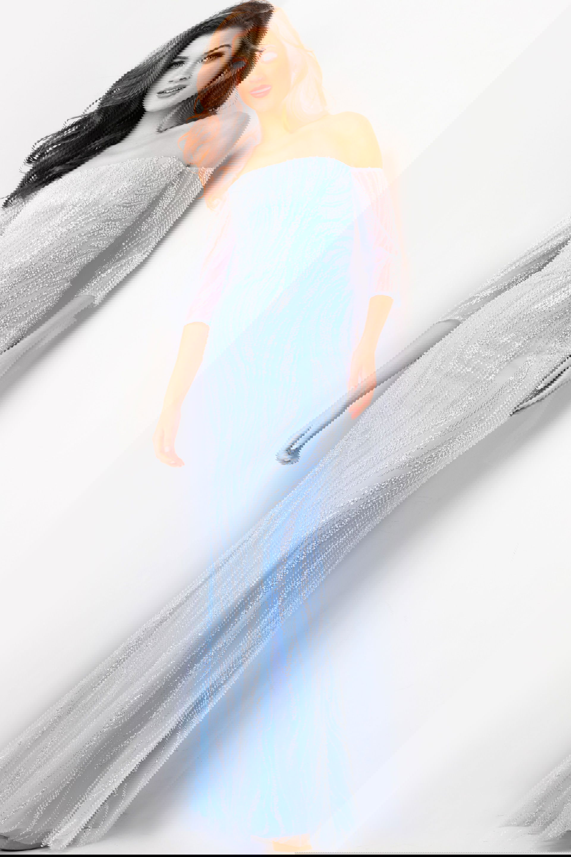 38614-LIGHTBLUE-49.jpg Model wearing Jovani 38614 light blue gown with sequin embellishments, front view