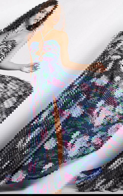 Model wearing Jovani 38638 navy floral dress with sweetheart neckline and pleated skirt.