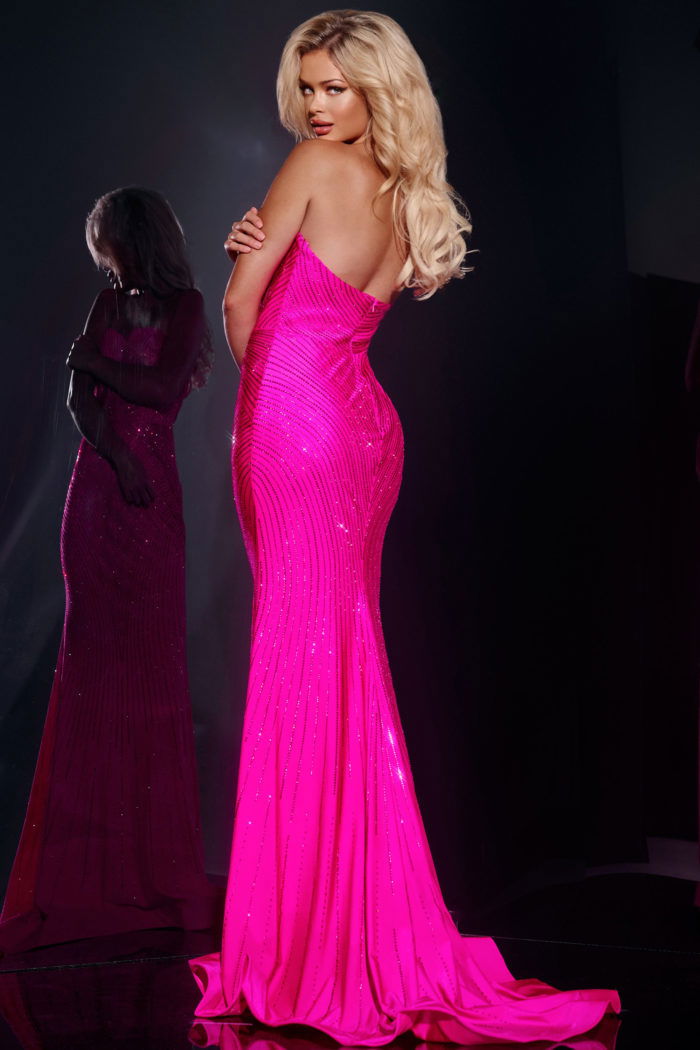 Model showing back view of Jovani 38655 pink strapless gown.