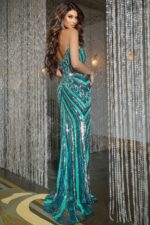 Model wearing 38707 purple gown with sweetheart neckline and high slit.