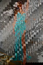 Model wearing 38707 green gown with sweetheart neckline and high slit.