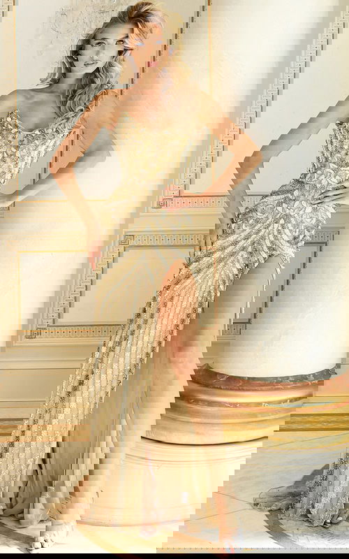 Strapless beaded gown with intricate embroidery and high slit