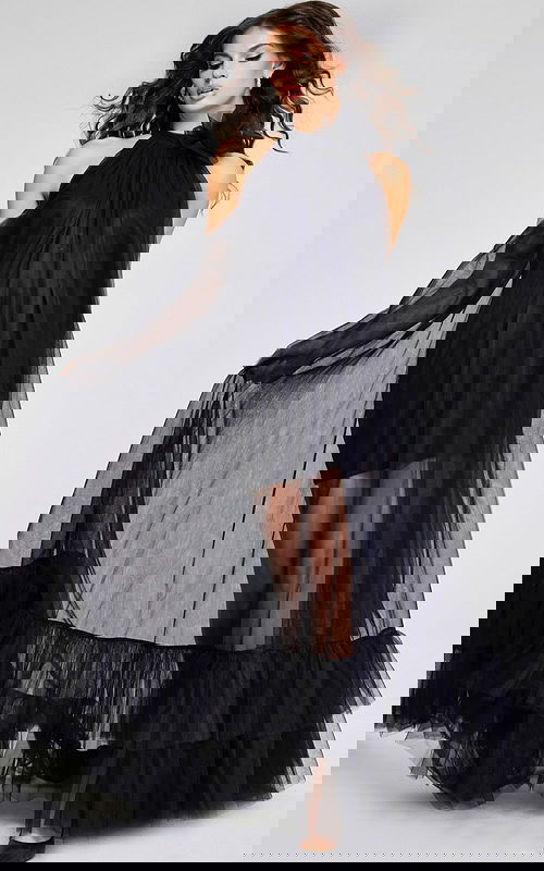 model wearing Jovani 38720 black dress with halter neckline and ruffled tiers