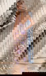 Back view of Jovani 38776 multicolor sequin gown showing a low V-back with beaded straps and allover pink, purple, and gold floral medallion pattern on nude mesh with a small train.