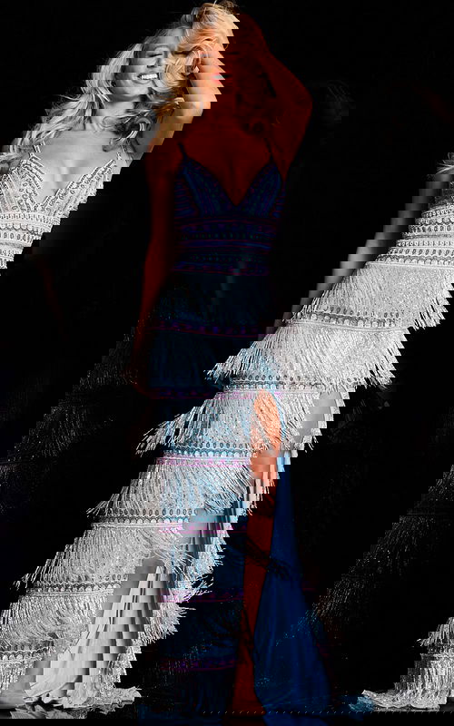 Model wearing Jovani 38846 blue gown with tassel details and thigh-high slit, front view.