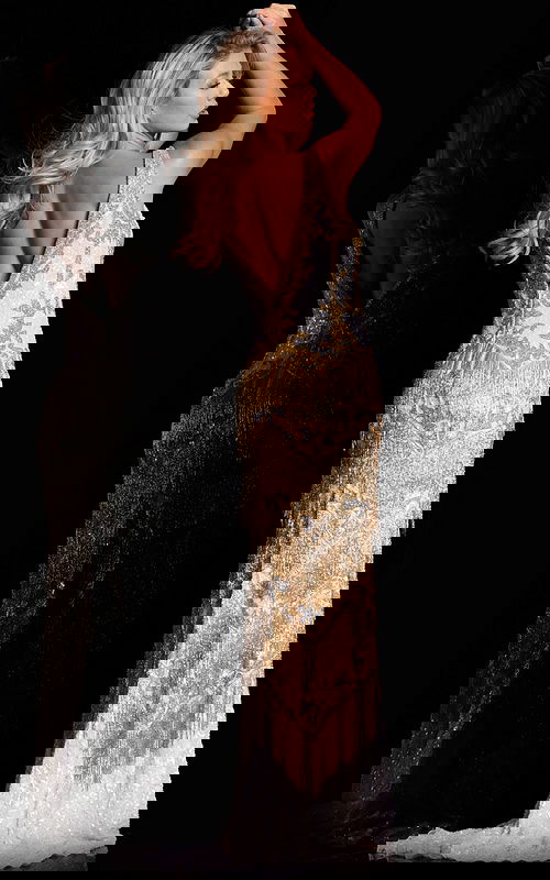 model wearing 38847 white gown back view with fringe details