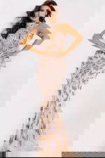 Sleeveless mermaid gown with intricate floral beadwork and halter neckline