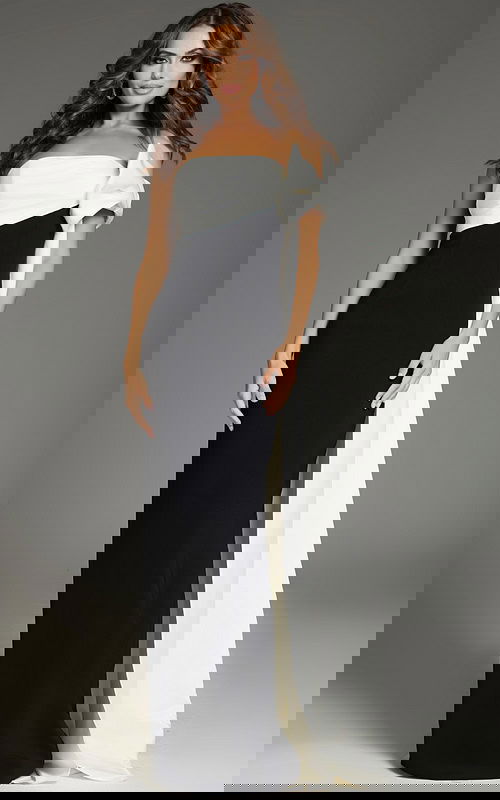 Model wearing Jovani 38864 floor-length black and white gown with off-the-shoulder neckline