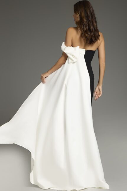 Back view of Jovani 38864 elegant black and white gown with draped shoulder