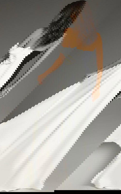 Back view of Jovani 38864 elegant black and white gown with draped shoulder