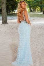 Model wearing Jovani 38912 back view showcasing a low scoop back in blue.
