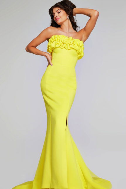 Model wearing Jovani 38922 in yellow, front view with ruffled neckline.
