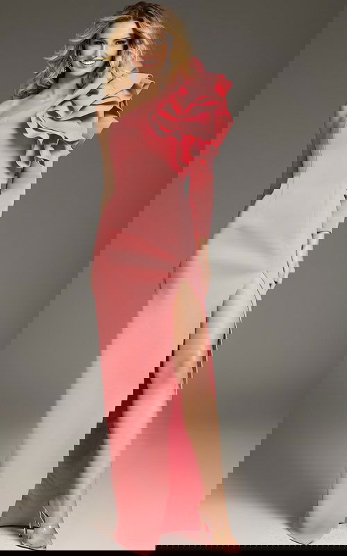 Model wearing Jovani 38928 fuchsia gown with ruffled one-shoulder neckline and high slit.