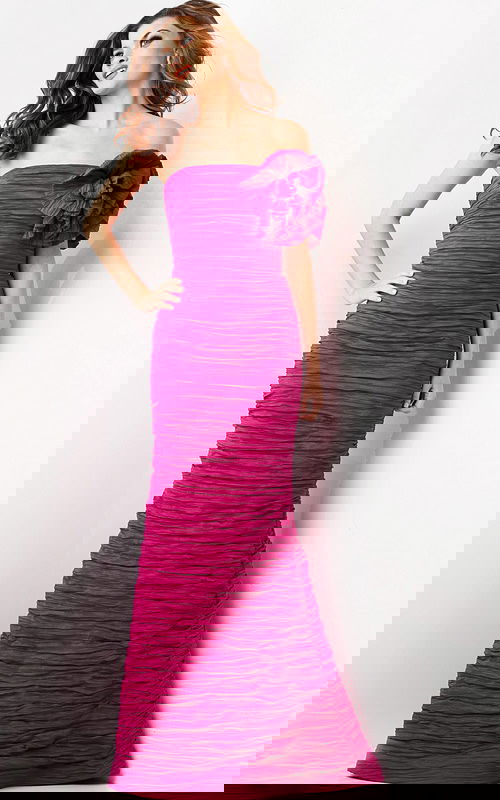 Model wearing Jovani 38947 fuchsia evening gown with strapless neckline and floral shoulder detail.