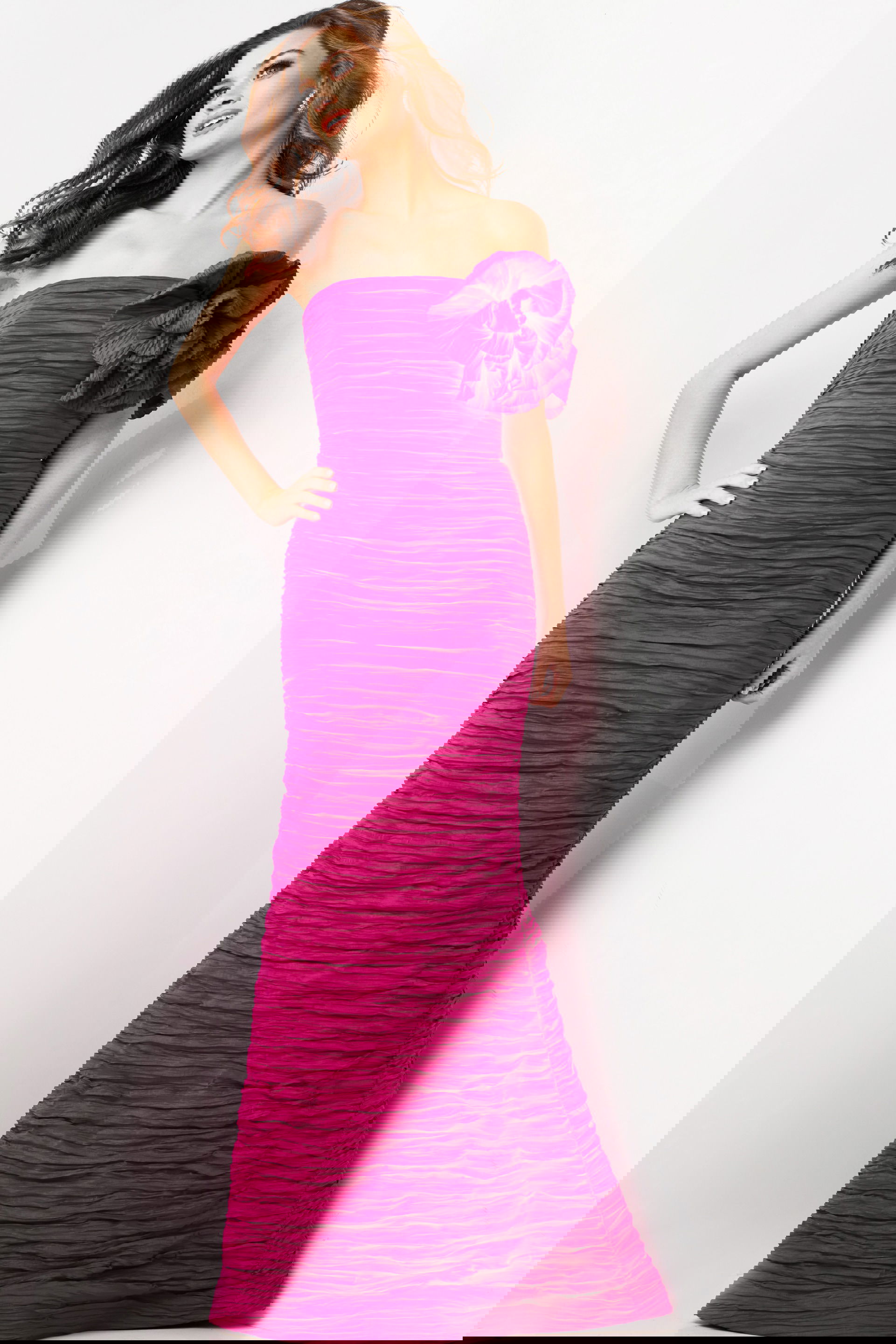 38947-FUCHSIA-28.jpg Model wearing Jovani 38947 fuchsia evening gown with strapless neckline and floral shoulder detail.