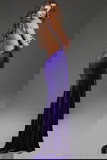 Model wearing Jovani 38951 purple gown with an open back, back view.