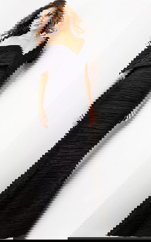 Model wearing Jovani 38954 black gown, front view with mermaid silhouette.