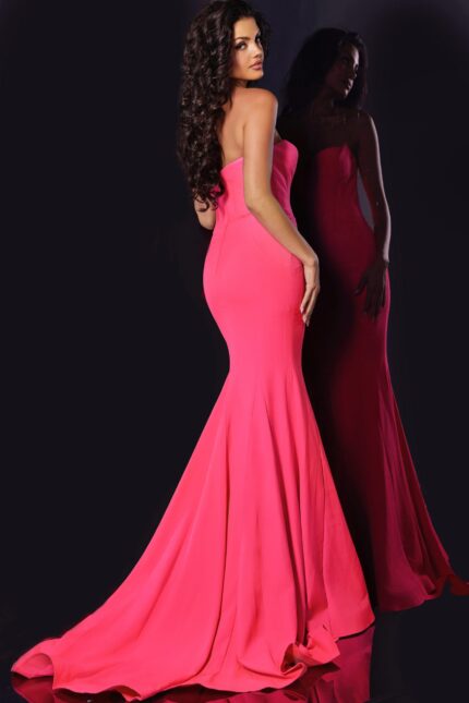 Back view of model wearing Jovani 38974 pink mermaid gown with flared silhouette