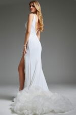 Model wearing Jovani 38993 elegant white gown showing the back view and train detail.