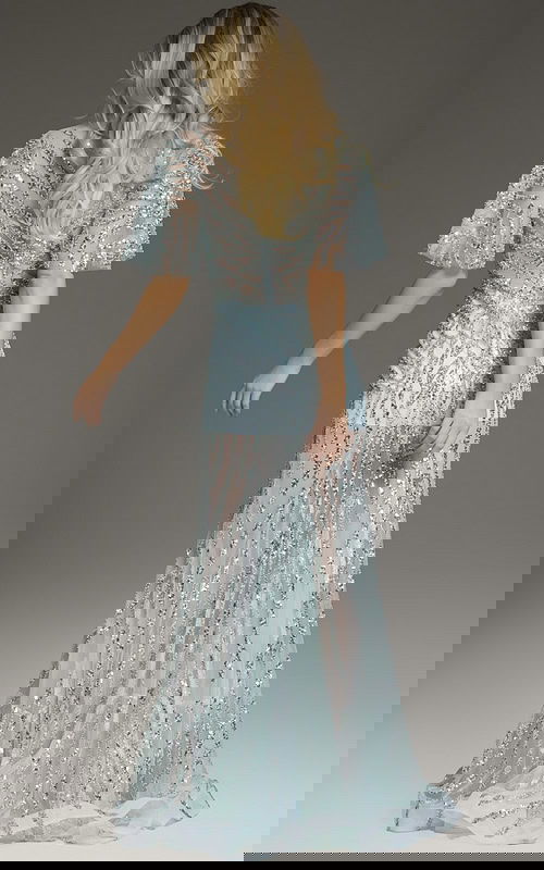 Back view of model wearing Jovani 39008 blue gown with glittering accents.