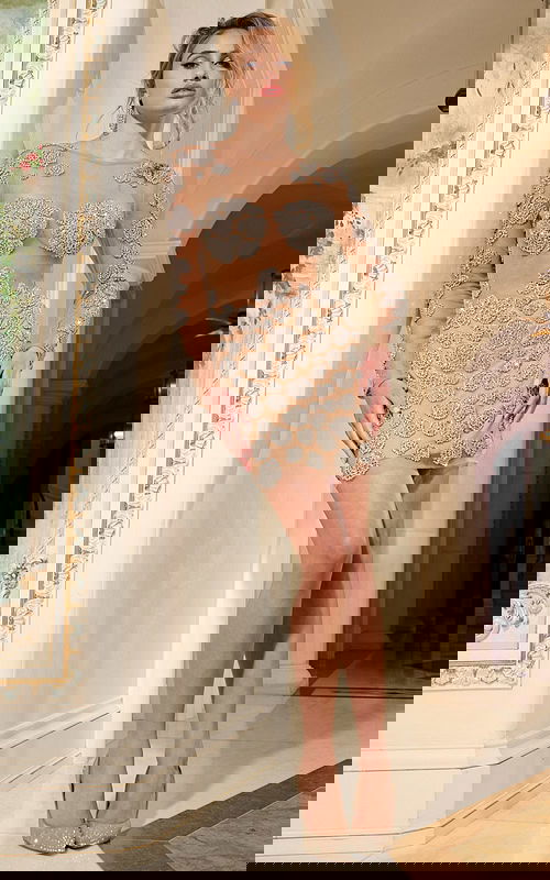 Model wearing 39015 nude dress with back view, long sleeves, and floral embellishments.