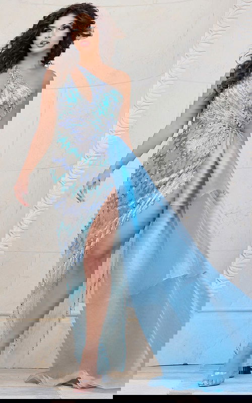 Model wearing Jovani 39055 blue gown with asymmetrical neckline and high slit.