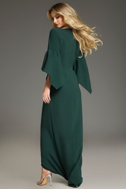 Model wearing Jovani 39082 green dress, showing back view with bell sleeves