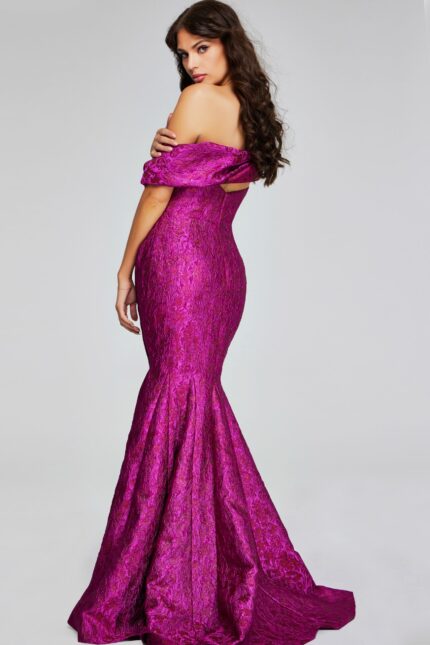 Side-back view of model in Jovani 39114 fuchsia gown.