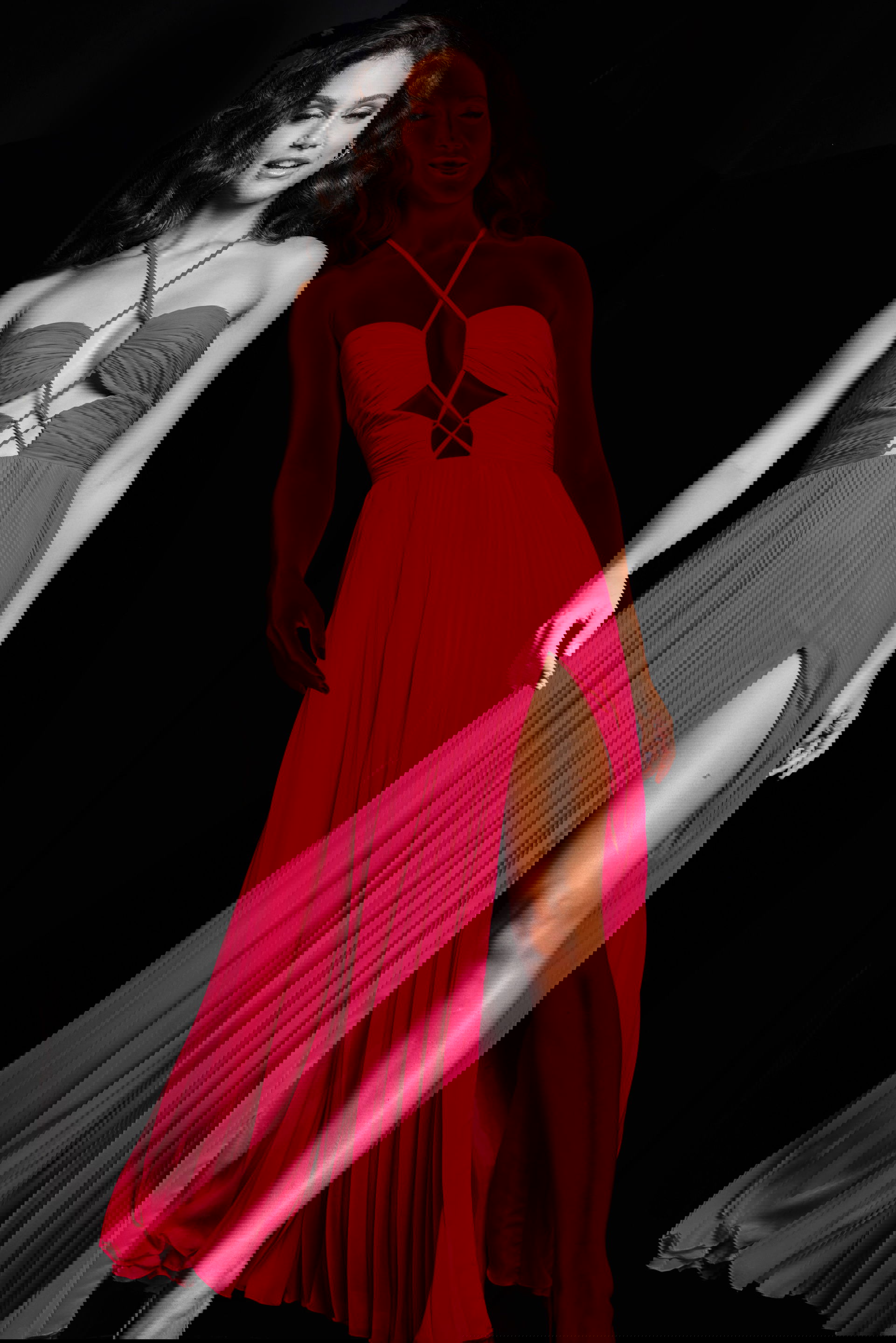 39139_FUCHSIA_7.jpg model wearing Jovani 39139 fuchsia gown with criss-cross halter and high slit