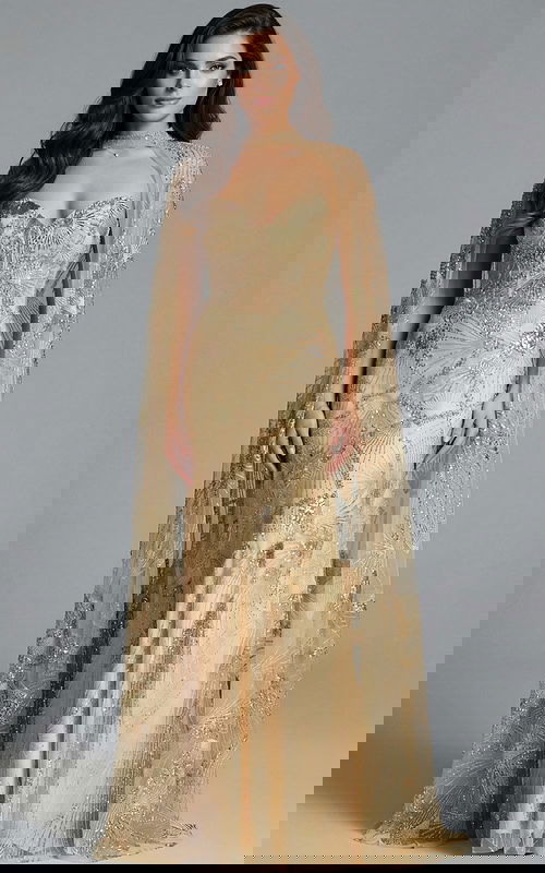 Model wearing gold strapless embellished gown with sheer beaded cape and intricate sequin pattern.