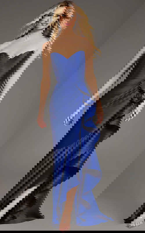 Model wearing Jovani 39265 blue gown with sweetheart neckline and ruffled skirt