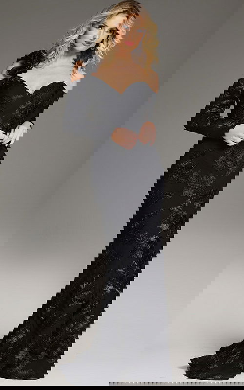 Model wearing Jovani 39266 elegant black off-the-shoulder gown with floral details, front view.