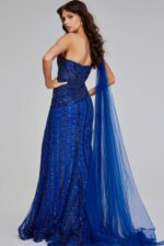 back view of model wearing Jovani 39386 navy gown with cascading fabric and beading