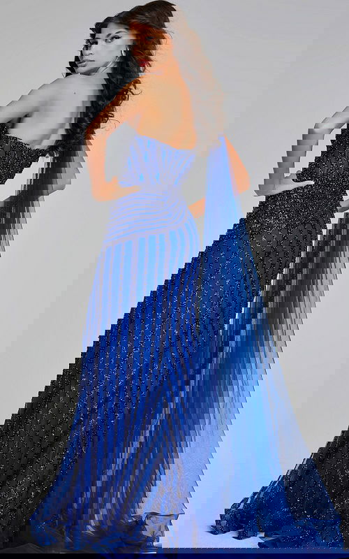 back view of model wearing Jovani 39386 navy gown with cascading fabric and beading