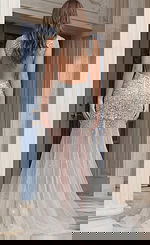 Back view of Jovani 39502 silver crystal embellished pageant gown featuring an open back, dense rhinestone beading on the bodice, and sheer tulle skirt with scattered crystal accents.