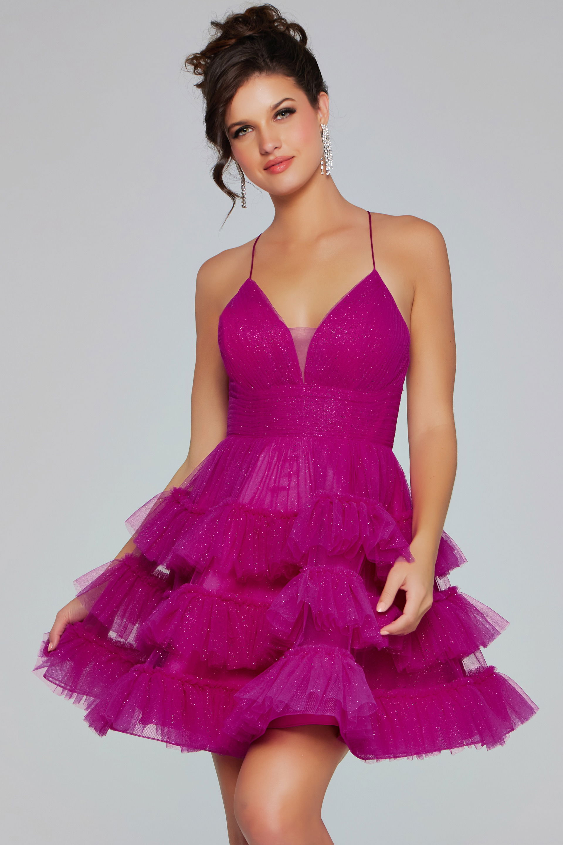 39655-203.jpg Model wearing Jovani 39655 dress with ruffled tulle and V-neckline in fuchsia.