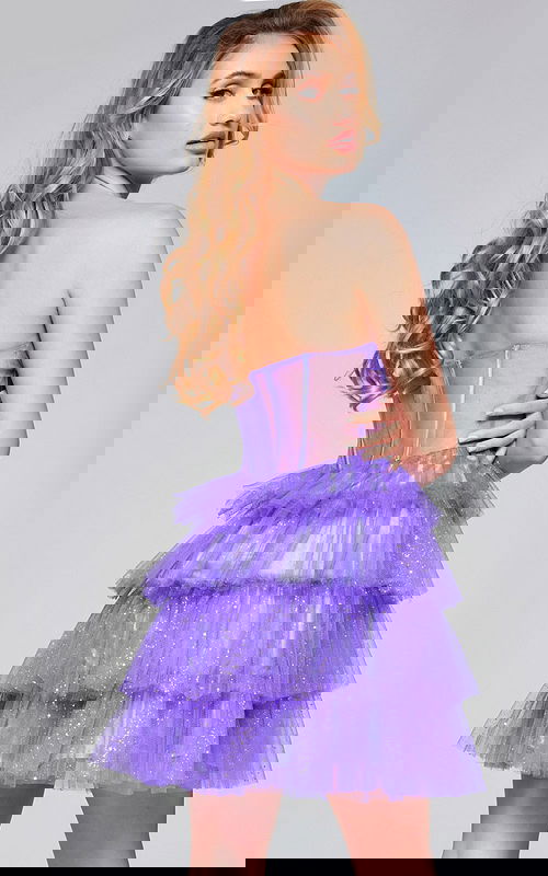 Model wearing Jovani 39666 purple dress, back view with hand on waist.