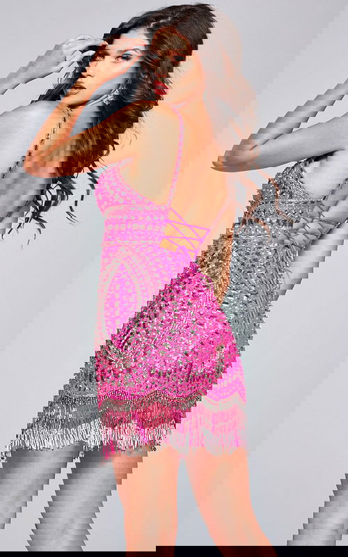 Back view of model in Jovani 39706 pink dress with criss-cross straps