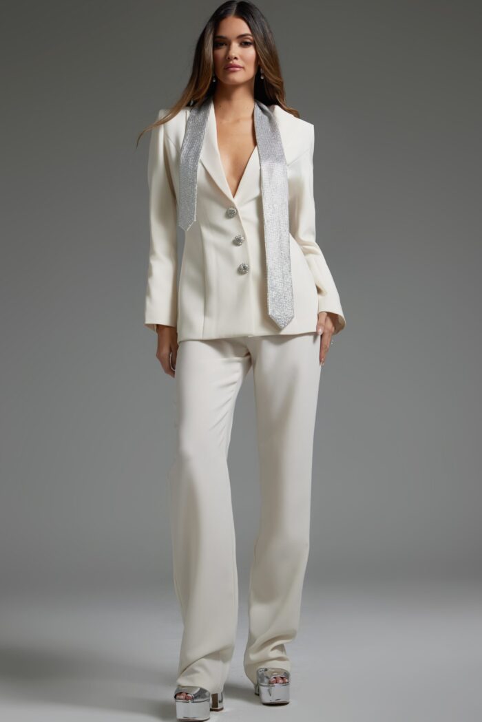Model wearing Jovani 39726 ivory pant suit with silver embellishments, alternate front view.