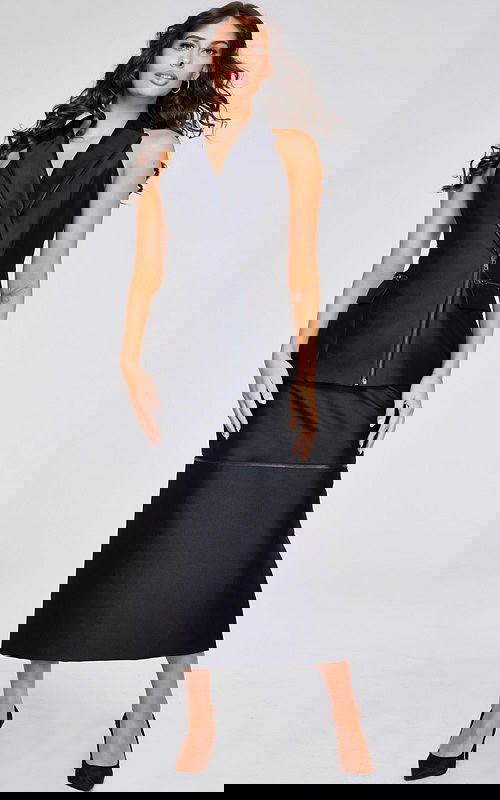 Model wearing Jovani 39801 elegant black sleeveless dress from the front with zipper details.