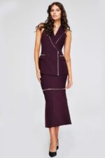 Model wearing Jovani 39802 plum dress with V-neckline and zipper details